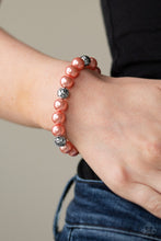 Load image into Gallery viewer, Paparazzi's Rosy Radiance - Orange Pearl bracelet
